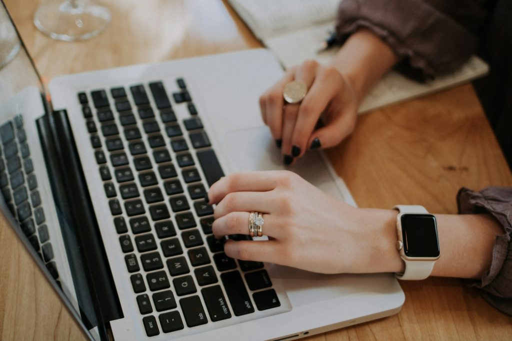 Person working on a website design on a laptop