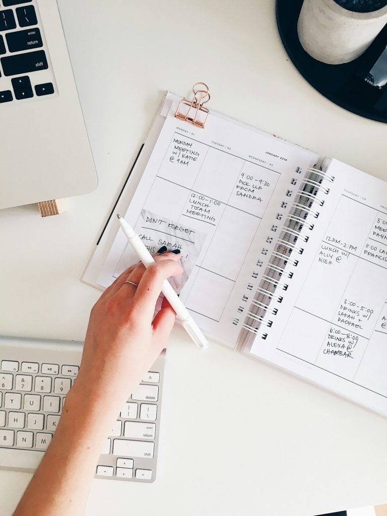 Notebook and pen on a desk for planning a website